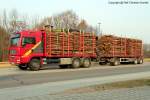 MAN TGA 33.480 6x6 Holztransporter mit Ladekran und Anhänger für Kurzholz - Aufbau: DOLL, Deutschland - Forst - fotografiert am 29.01.2012 im Land Brandenburg - Copyright @ Ralf Christian Kunkel