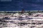 HDR-Bild von der Ostsee - bei diesem Wetter und trotz der Ankündigung eines Regenschauers fühlten sich die Surfer auf ihren Boarden wohl - Freizeitsport, Windsurfen, Ostsee - das Originalfoto entstand am 25.06.2012 in Warnemünde - Copyright @ Ralf Christian Kunkel 
